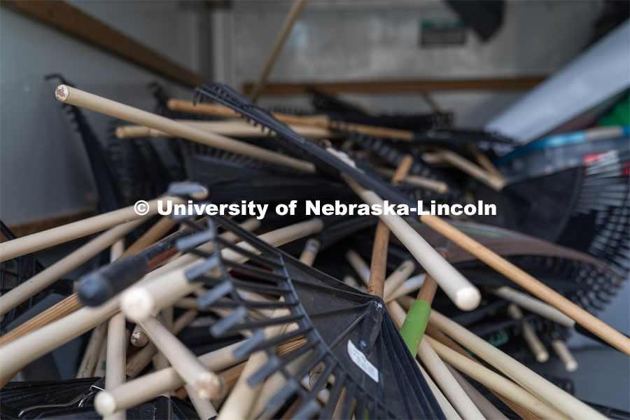 Stacks of garden rakes available for checkout for student volunteers for the Big Event. May 4, 2024. Photo by Kirk Rangel for University Communication.